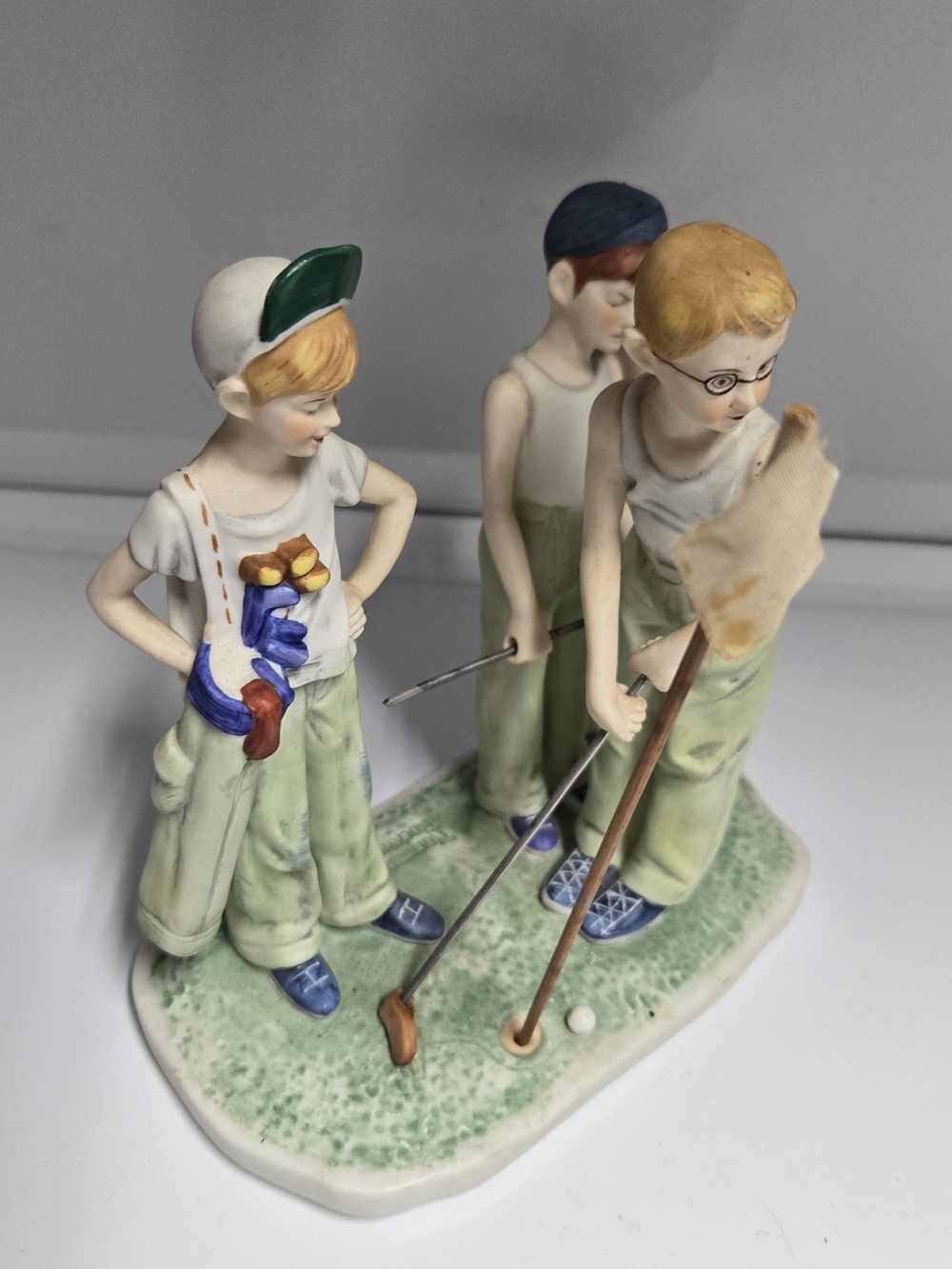 Porcelain Figurine of Three Boys Playing Golf - Green and Cream